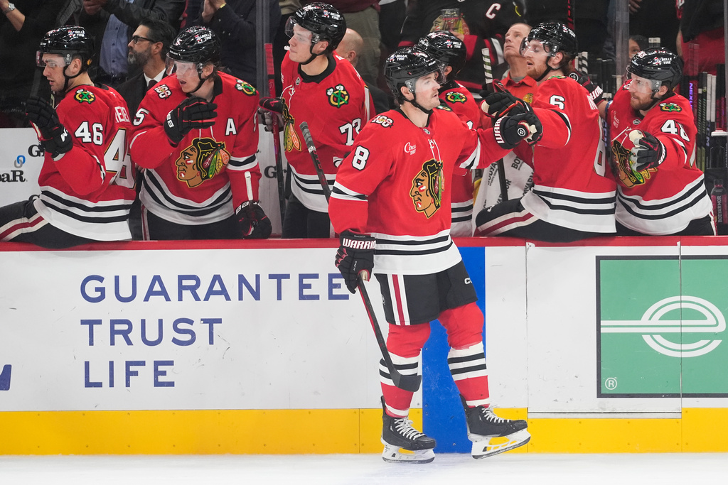 Chicago Blackhawks center Ryan Donato (8) celebrates his goal against the Vancouver Canucks during the first period of an NHL hockey game Friday, Oct. 17, 2025, in Chicago. (AP Photo/Erin Hooley)