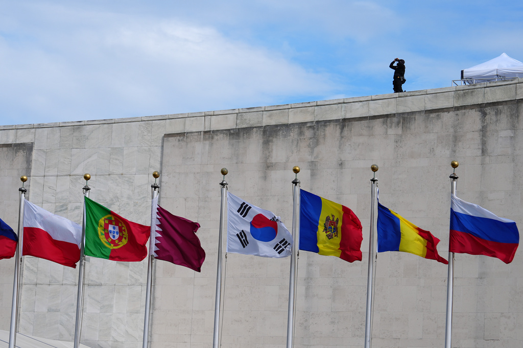 Flags fly at the United Nations Tuesday, Sept. 22, 2026, at the UN headquarters, as security keeps watch. (AP Photo/Julia Demaree Nikhinson)