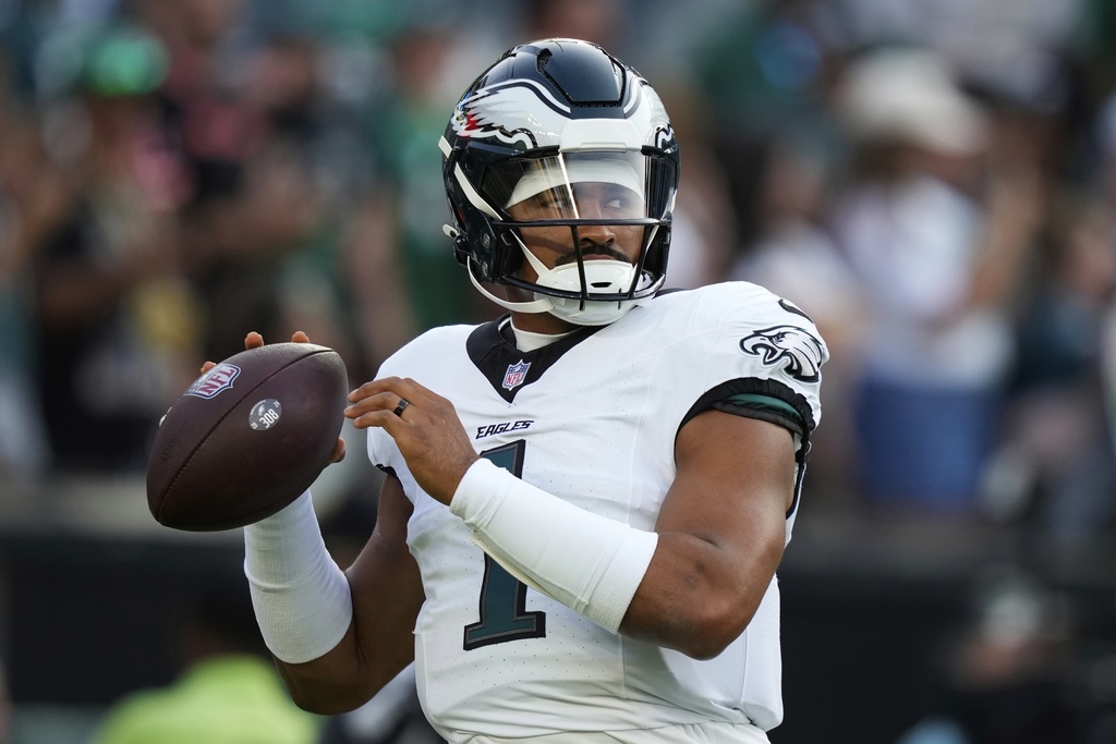 Philadelphia Eagles quarterback Jalen Hurts warms up before an NFL preseason football game against the Cincinnati Bengals on Thursday, Aug. 7, 2025, in Philadelphia. (AP Photo/Matt Slocum)