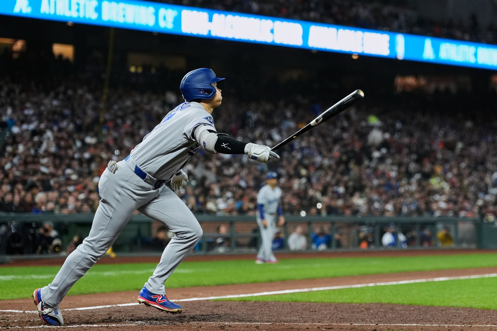 Los Angeles Dodgers' Shohei Ohtani watches his fly ball hit to San Francisco Giants center fielder Drew Gilbert for an out during the fifth inning of a baseball game Tuesday, April 21, 2026, in San Francisco. (AP Photo/Godofredo A. Vásquez)