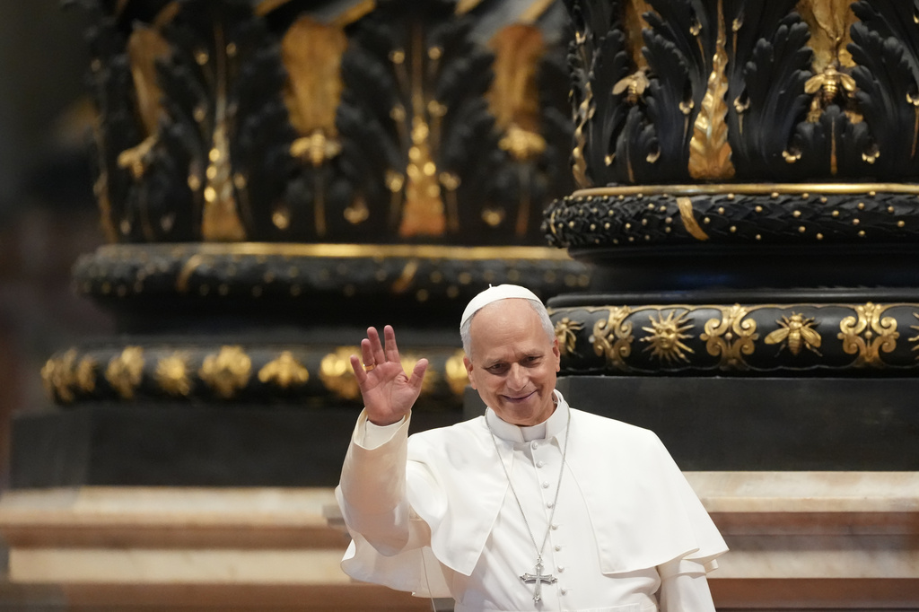 Pope Leo XIV waves to faithful on the occasion of the weekly general audience in St. Peter's Basilica,at the Vatican, Wednesday, Aug. 5, 2026. (AP Photo/Gregorio Borgia)