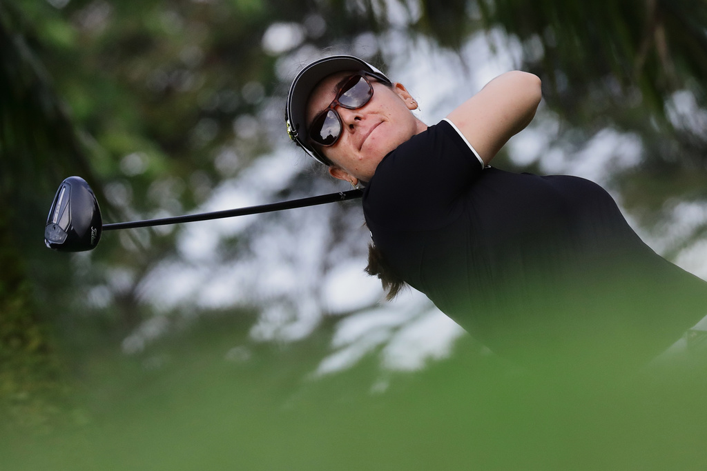 Hannah Green of Australia tees off during the HSBC Women's World Championship at Sentosa Golf Club in Singapore, Thursday, Feb. 26, 2026. (AP Photo/Suhaimi Abdullah)