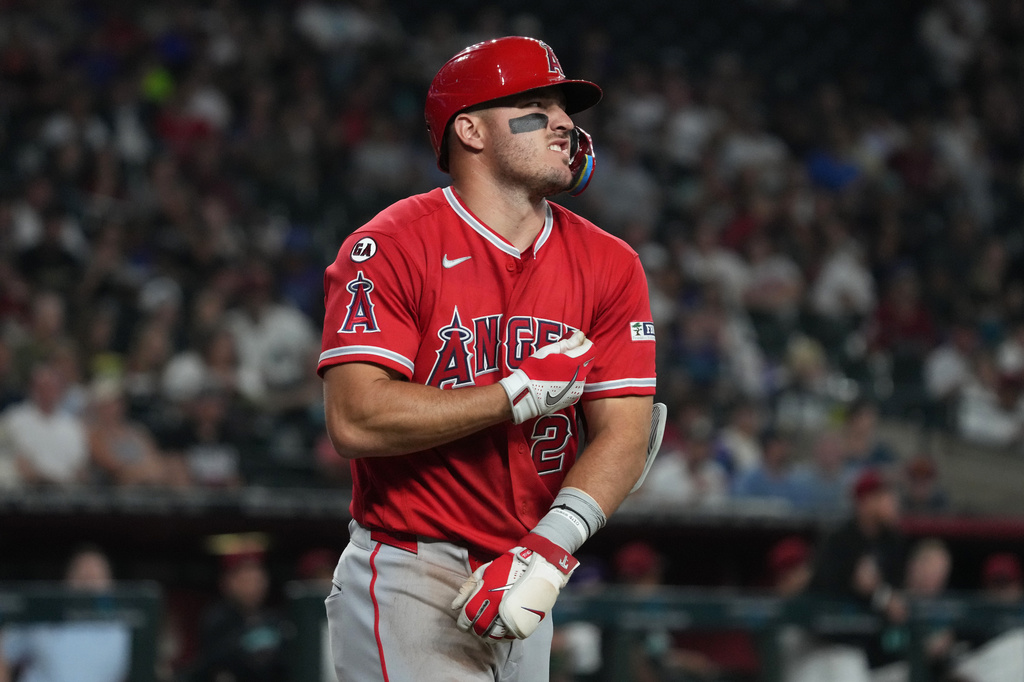 Los Angeles Angels' Mike Trout reacts after getting hit with a pitch in the third inning of a baseball game against the Arizona Diamondbacks, Monday, June 15, 2026, in Phoenix. (AP Photo/Rick Scuteri)