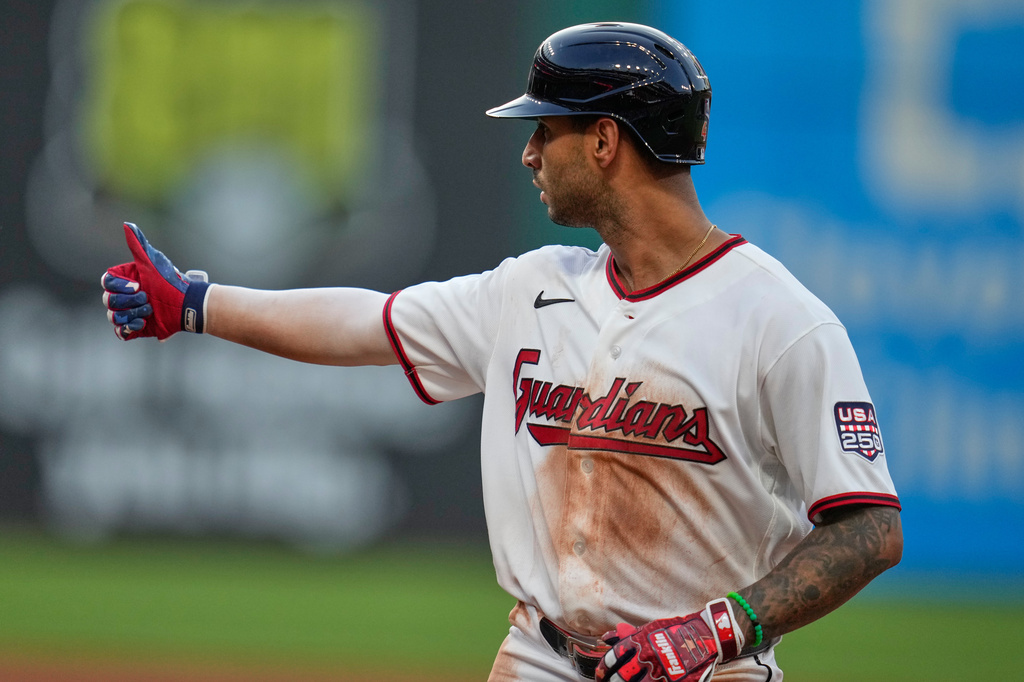 Cleveland Guardians' Brayan Rocchio gestures to the dugout after hitting a single in the fourth inning of a baseball game against the Chicago White Sox in Cleveland, Saturday, July 4, 2026. (AP Photo/Sue Ogrocki)
