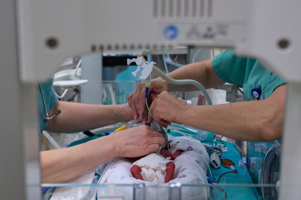 Medical staff transfer patients to a protected underground facility following an Iranian missile attack, at Ichilov Hospital in Tel Aviv, Israel, Monday, June 8, 2026. (AP Photo/Ohad Zwigenberg)