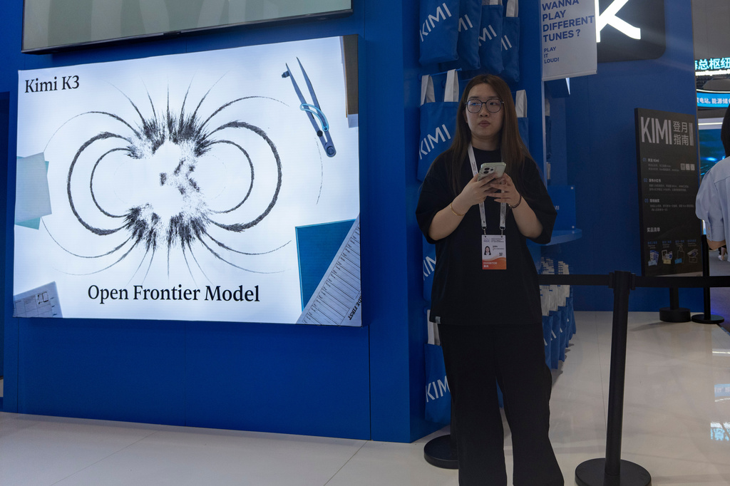 Visitors at the booth for Moonshot's Kimi K3 during World AI Conference in Shanghai, Friday, July 17, 2026. (AP Photo/Ng Han Guan)