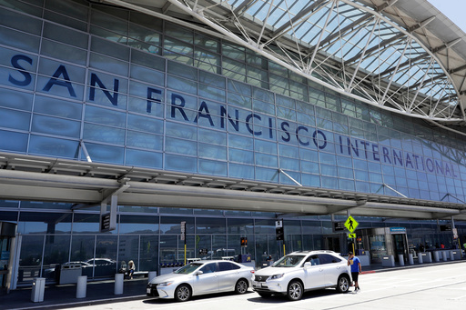 FILE - Vehicles wait outside the international terminal at San Francisco International Airport in San Francisco, July 11, 2017. (AP Photo/Marcio Jose Sanchez, File) FILE - Vehicles wait outside the international terminal at San Francisco International Airport in San Francisco, July 11, 2017. (AP Photo/Marcio Jose Sanchez, File)