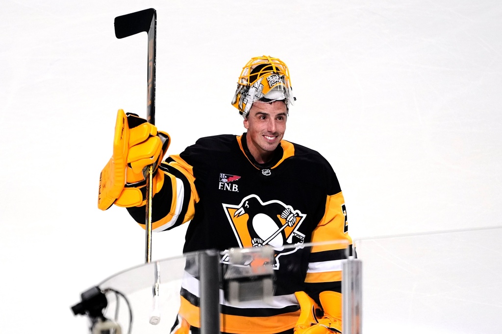 Pittsburgh Penguins goalie Marc-Andre Fleury acknowledges fans after being named the number one star in a pre-season NHL hockey game against the Columbus Blue Jackets in Pittsburgh, Saturday, Sept. 27, 2025. (AP Photo/Gene J. Puskar)