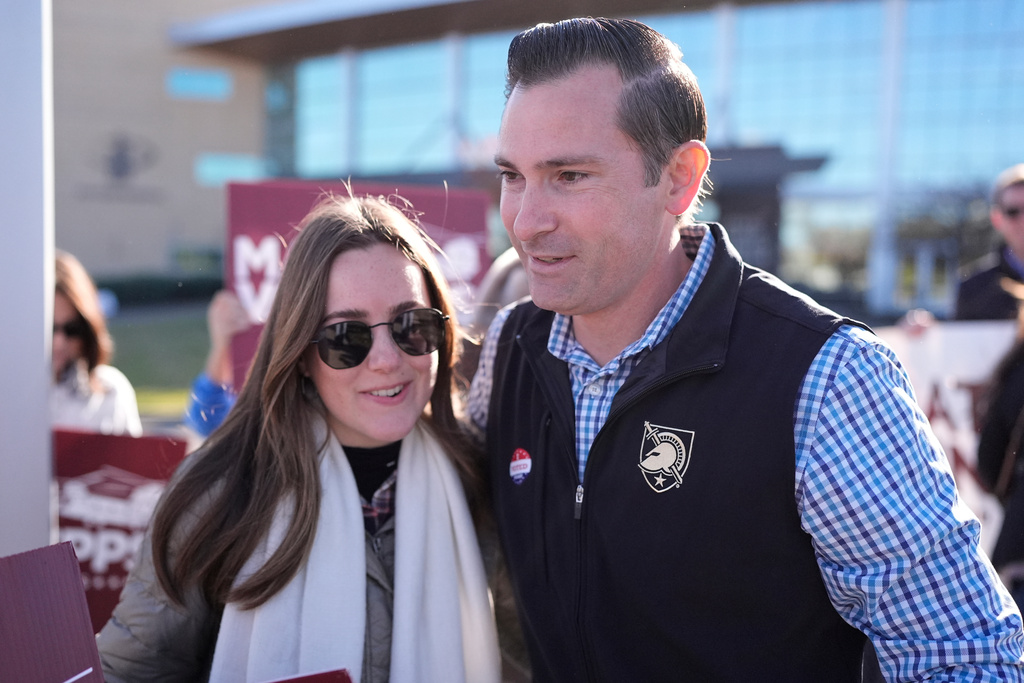 Republican congressional candidate Matt Van Epps, right, hugs a supporter during a campaign event in the special election for the seventh district Wednesday, Nov. 12, 2025, in Nashville, Tenn. (AP Photo/George Walker IV)