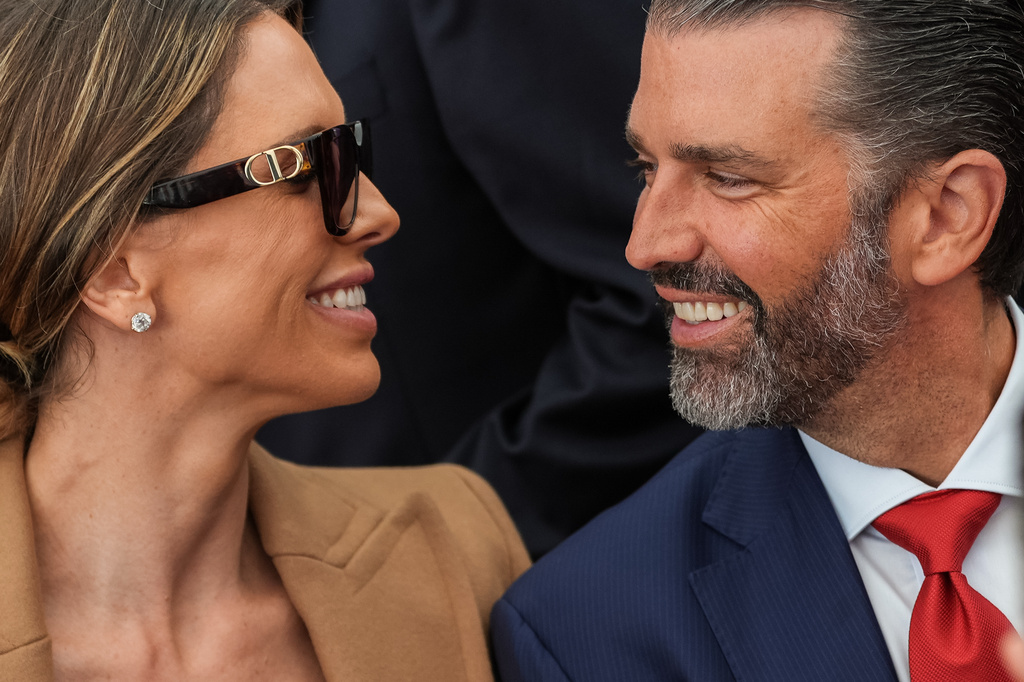 Donald Trump Jr. and his wife Bettina Anderson look at each other while waiting for President Donald Trump to speak at Deerfield Residence, the residence of the U.S. Ambassador to Ireland Edward S. Walsh, Saturday, Sept. 12, 2026, in Dublin. (AP Photo/Julia Demaree Nikhinson)