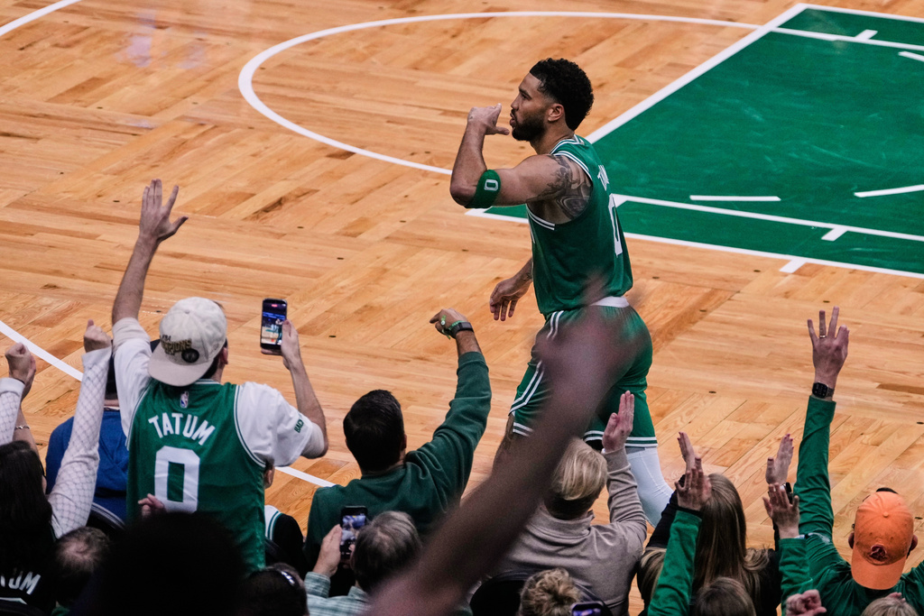 Boston Celtics forward Jayson Tatum blows a kiss to fans after making a 3-pointer against the Dallas Mavericks during the second half of an NBA basketball game, Friday, March 6, 2026, in Boston. (AP Photo/Charles Krupa)