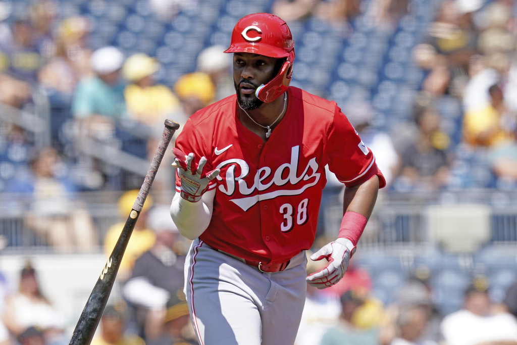 Cincinnati Reds' Miguel Andujar tosses his bat after hitting a three-run home run during the third inning of a baseball game against the Pittsburgh Pirates, Sunday, Aug. 10, 2025, in Pittsburgh. (AP Photo/Matt Freed)