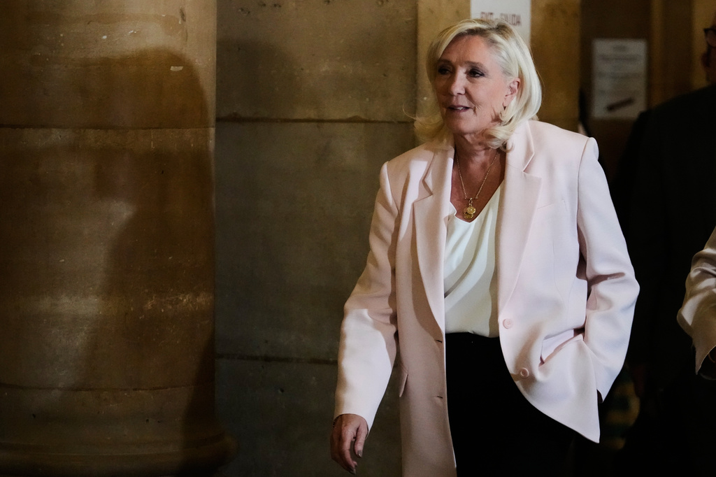 Far-right leader Marine Le Pen arrives at the courtroom for the verdict of her appeals trial, in Paris, France, Tuesday, July. 7, 2026. (AP Photo/Michel Euler)