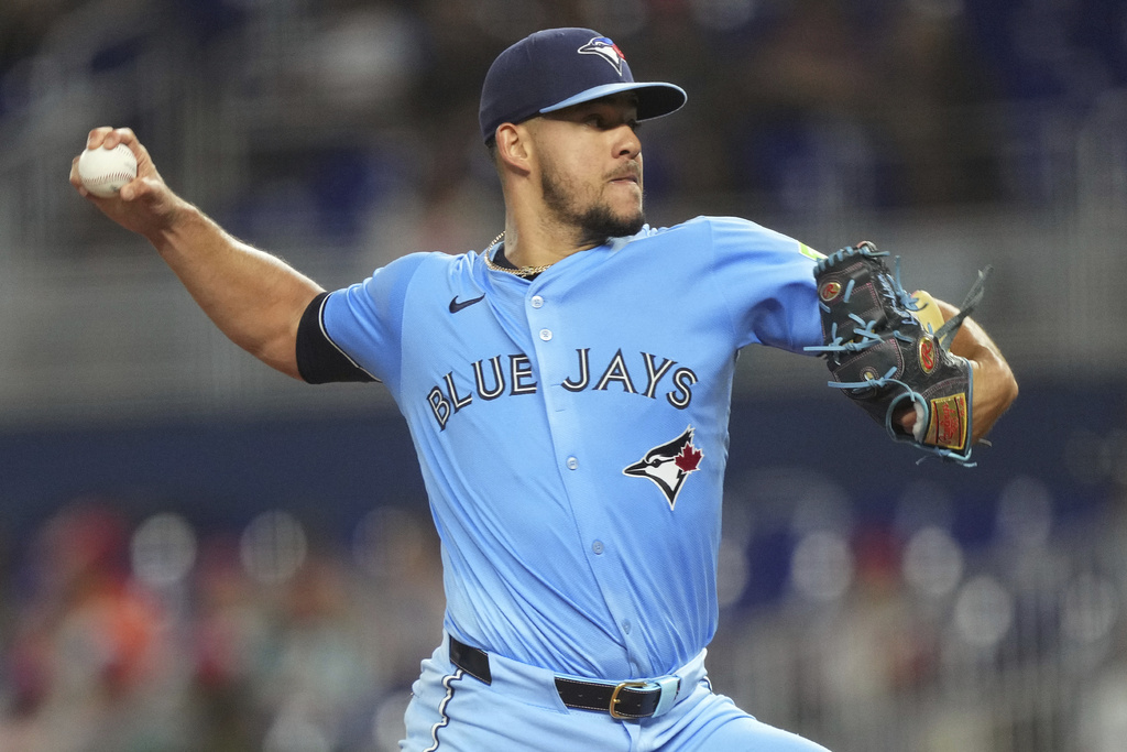 Toronto Blue Jays starting pitcher Jose Berrios throws during the first inning of a baseball game against the Miami Marlins, Saturday, Aug. 23, 2025, in Miami. (AP Photo/Jim Rassol)