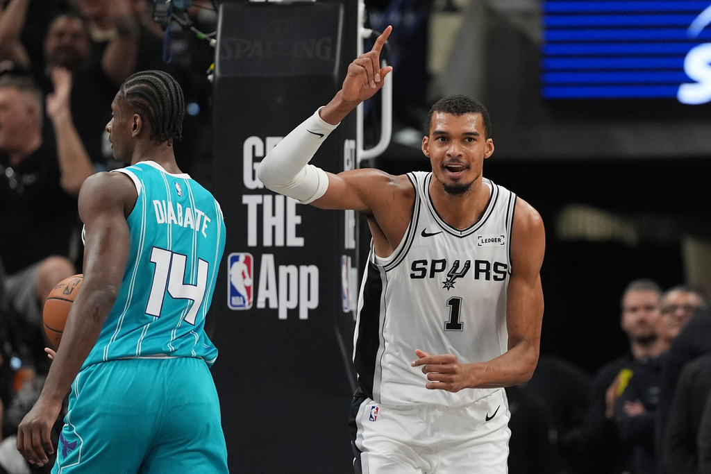 San Antonio Spurs forward Victor Wembanyama (1) celebrates a score during the second half of an NBA basketball game against the Charlotte Hornets in San Antonio, Saturday, March 14, 2026. (AP Photo/Eric Gay)