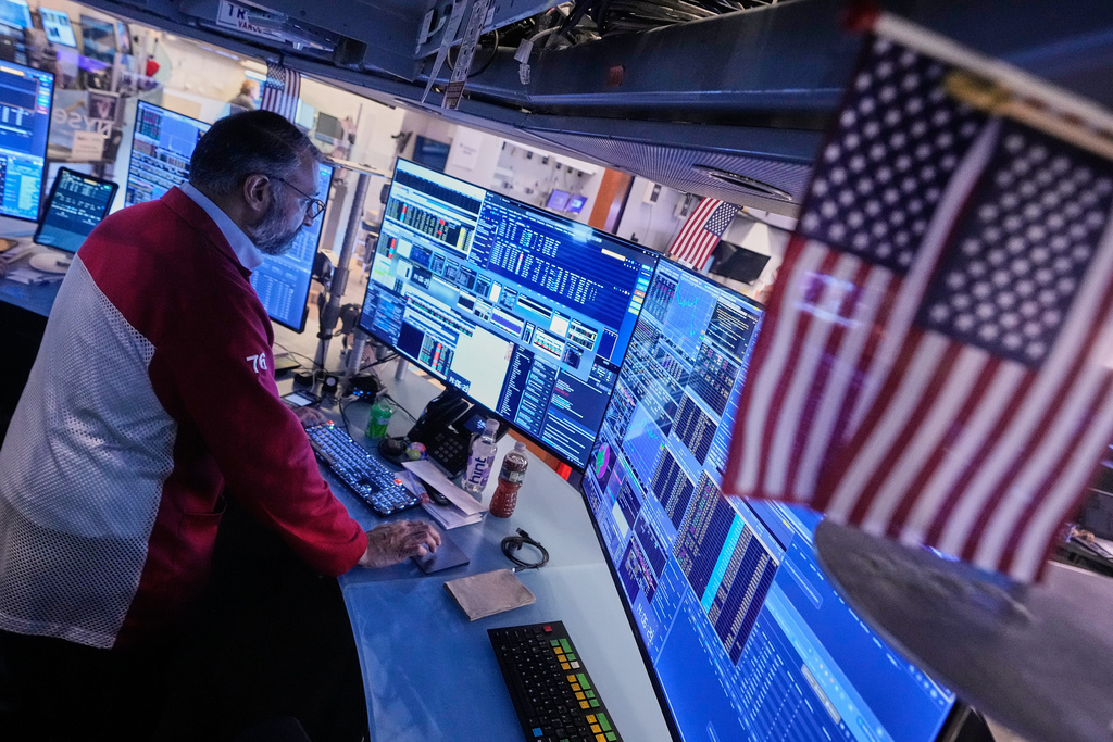 Trader Aman Patel works on the floor of the New York Stock Exchange, Thursday, Nov. 6, 2025. (AP Photo/Richard Drew)