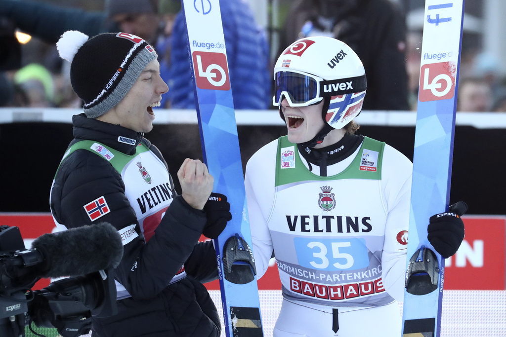 FILE - Johann Andre Forfang, left, and Marius Lindvik, both of Norway, celebrate after the final round at the second stage of the 68th four hills ski jumping tournament in Garmisch-Partenkirchen, Germany, Wednesday, Jan. 1, 2020. (AP Photo/Matthias Schrader, File)