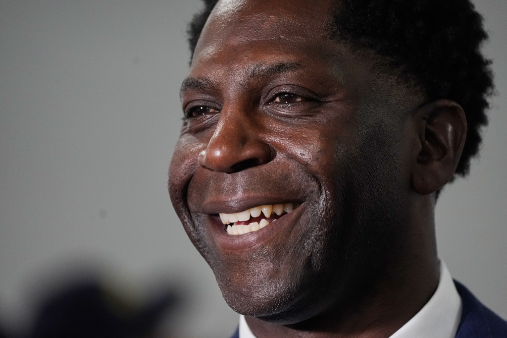 Chedrick Greene, Democratic candidate for 35th Senate District, smiles with supporters Tuesday, May 5, 2026 in Saginaw, Mich. (AP Photo/Paul Sancya)