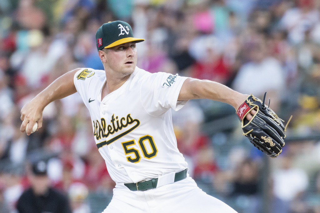 Athletics pitcher Jack Perkins throws to the Los Angeles Angels during the second inning of a baseball game Friday, Aug. 15, 2025, in West Sacramento, Calif. (AP Photo/Sara Nevis)