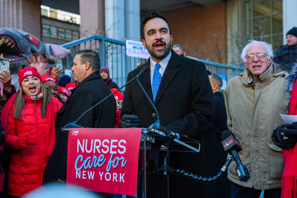 Mayor Zohran Mamdani and Senator Bernie Sanders (I-VT), speak in front of members of the New York State Nurses Association union during a picket outside Mount Sinai West Hospital, Tuesday, Jan. 20, 2026, in New York. (AP Photo/Ryan Murphy)