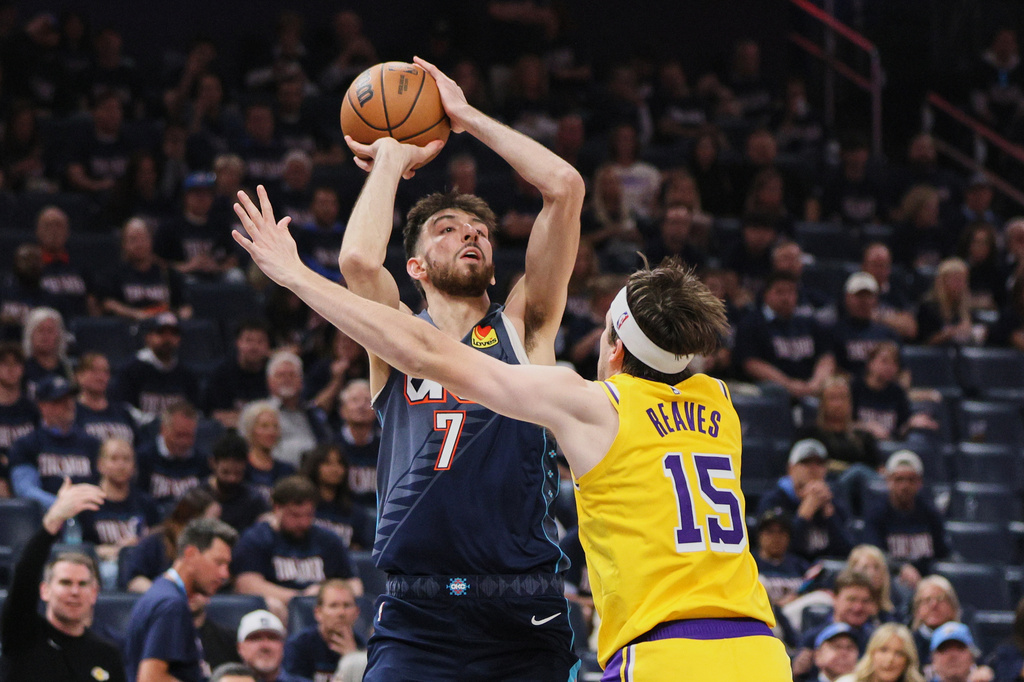 Oklahoma City Thunder's Chet Holmgren (7) shoots over Los Angeles Lakers' Austin Reaves (15) in the second half of Game 2 in a second-round NBA basketball playoffs series Thursday, May 7, 2026, in Oklahoma City. (AP Photo/Nate Billings)
