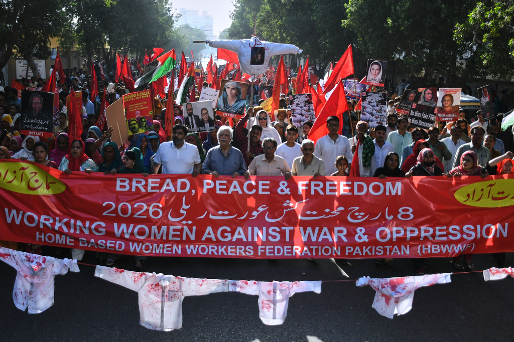 Women's right activists take part in a rally to mark International Women's Day, in Karachi, Pakistan, Sunday, March 8, 2026. (AP Photo/Ali Raza)