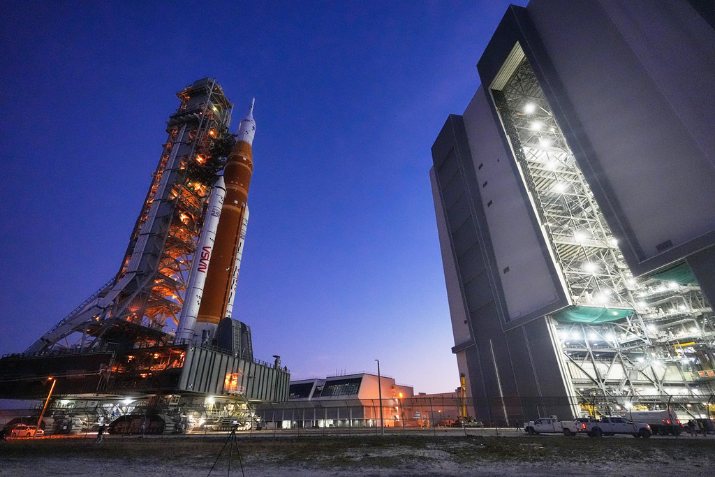 NASA's Artemis II SLS (Space Launch System) moon rocket with the Orion spacecraft slowly rolls back towards the Vehicle Assembly Building at the Kennedy Space Center, Wednesday, Feb. 25, 2026, in Cape Canaveral, Fla. (AP Photo/John Raoux)