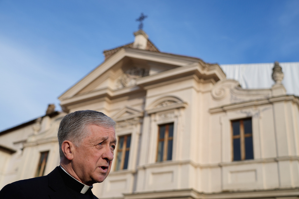 FILE - Archbishop of Chicago, Cardinal Blase Cupich, answers a journalist's question during an interview with The Associated Press, in front of St. Bartholomew church, in Rome, Thursday, Oct. 9, 2025. (AP Photo/Gregorio Borgia, File)