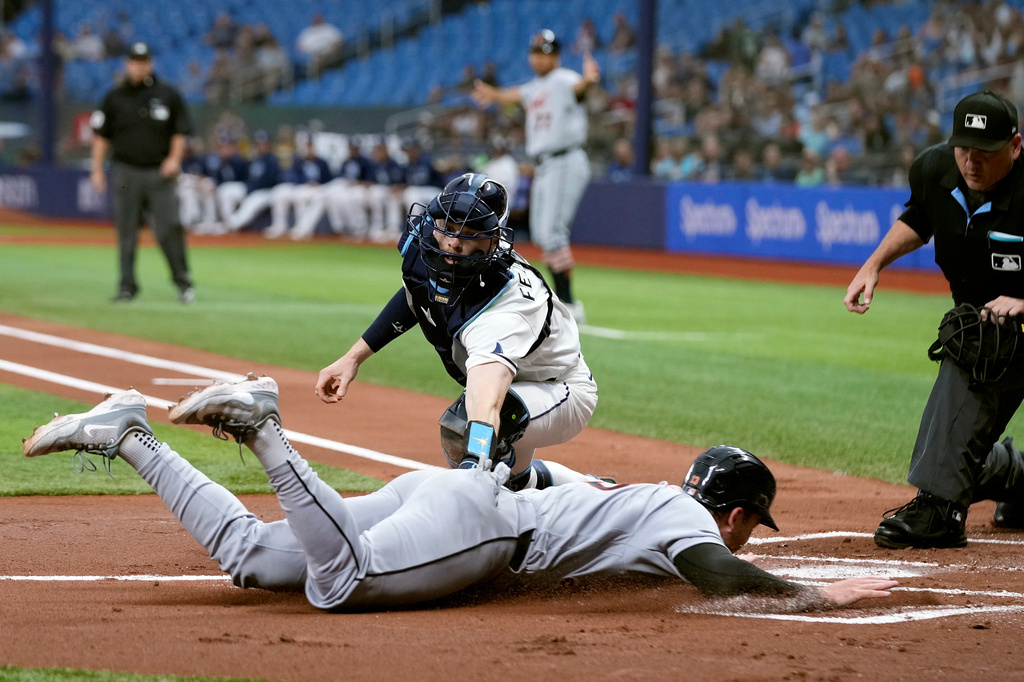 Detroit Tigers' Dillon Dingler (13) slides home safely ahead of the tag by Tampa Bay Rays catcher Hunter Feduccia on a two-run double by Riley Greene during the first inning of a baseball game Monday, June 1, 2026, in St. Petersburg, Fla. (AP Photo/Chris O'Meara)