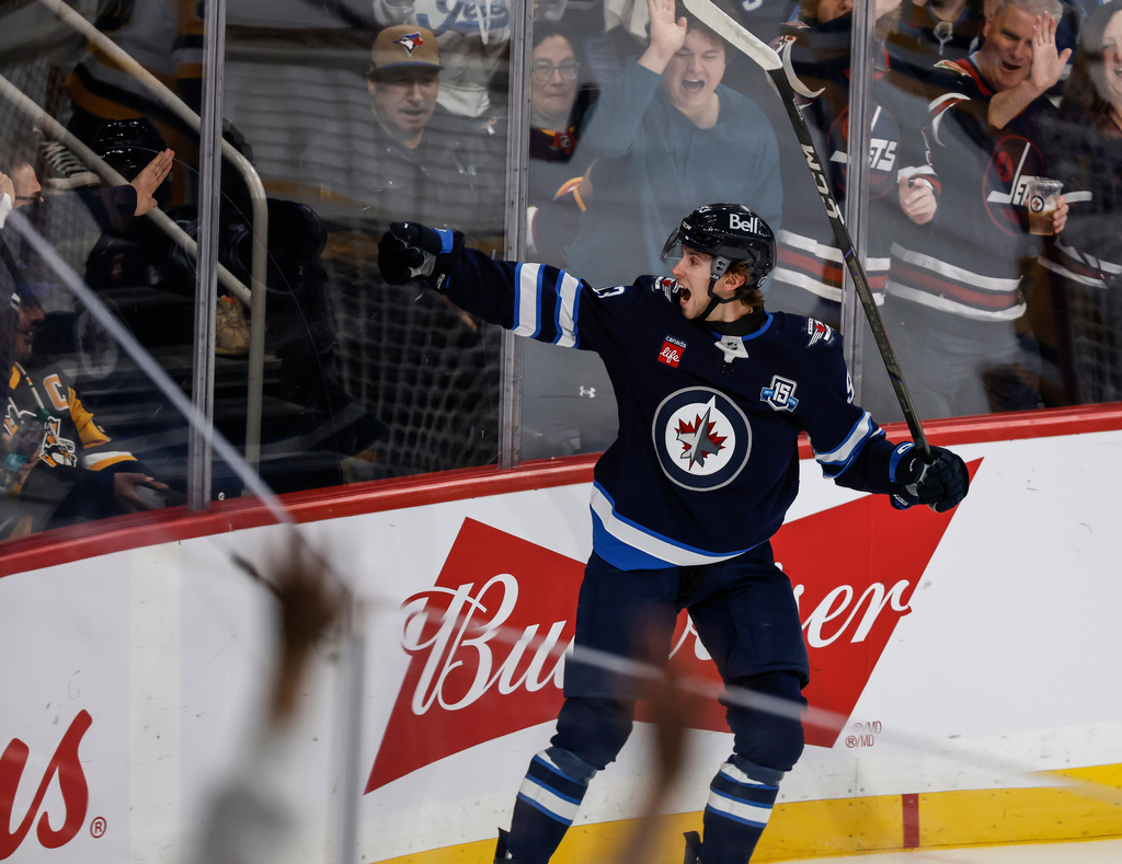 Winnipeg Jets' Brad Lambert (93) celebrates his goal against the Pittsburgh Penguins during the first period of an NHL hockey game, Saturday, Nov. 1, 2025, in Winnipeg, Manitoba. (John Woods/The Canadian Press via AP)