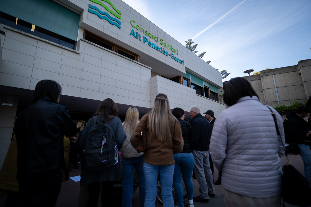 People gather outside a hospital where Noelia Castillo, a young Spanish woman, died after winning a long court fight for her right to euthanasia, in Sant Pere de Ribes, Spain, Thursday, March 26, 2026. (Lorena Sopena/Europa Press via AP)