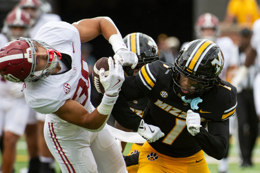 Alabama wide receiver Derek Meadows, left, is hit by Missouri safety Marvin Burks, right, during the first half an NCAA college football game Saturday, Oct. 11, 2025, in Columbia, Mo. Burks was ejected for targeting on the play. (AP Photo/L.G. Patterson)