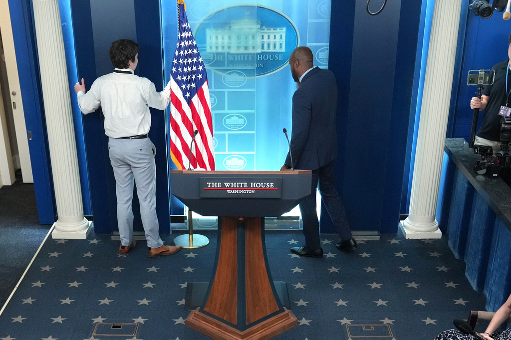 FILE - White House staff members remove monitors in the James Brady Press Briefing Room at the White House, July 16, 2026, in Washington. (AP Photo/Julia Demaree Nikhinson, File)