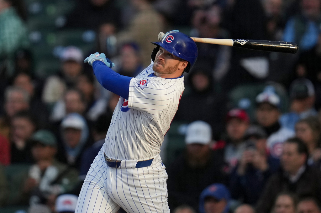 Chicago Cubs' Ian Happ hits a two-run home run during the first inning of a baseball game against the Cincinnati Reds, Wednesday, May 6, 2026, in Chicago. (AP Photo/Erin Hooley)