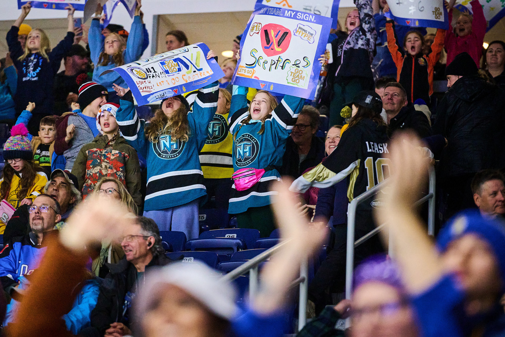 Young Toronto Sceptres fans cheer for their team during the third period of a PWHL hockey game against the Ottawa Charge, in Toronto, Thursday, Dec. 4, 2025. (Sammy Kogan/The Canadian Press via AP)