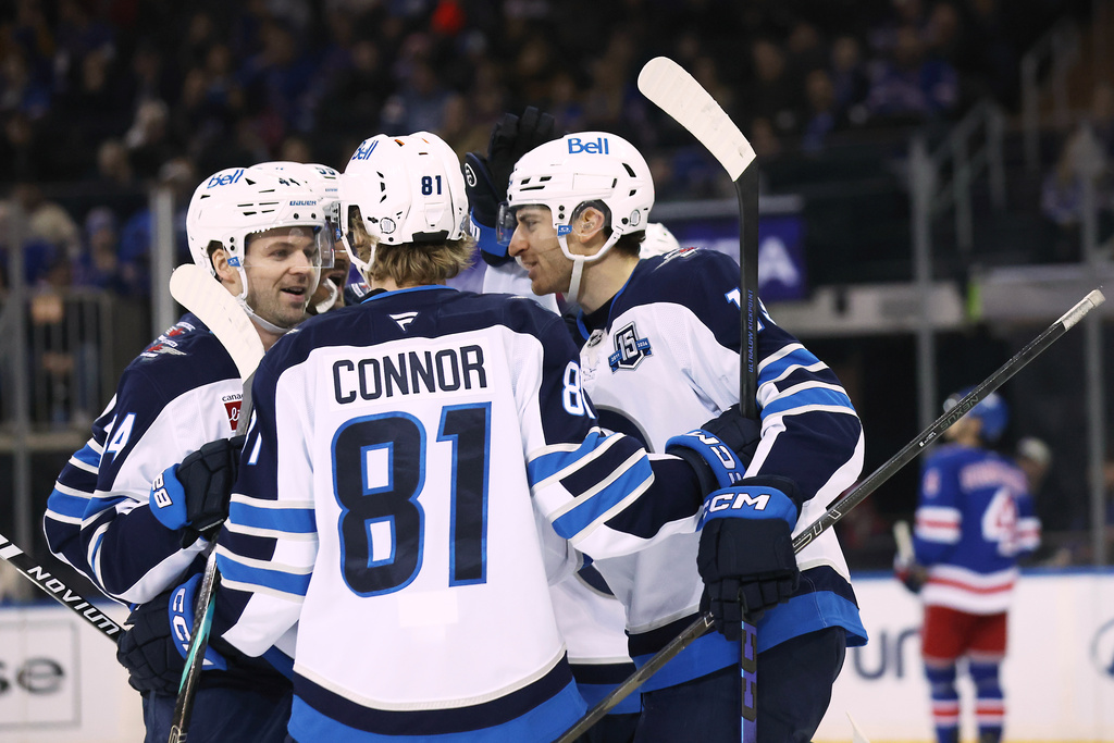 Winnipeg Jets center Gabriel Vilardi, right, celebrates with teammates after scoring on a power play during the second period of an NHL hockey game against the New York Rangers, Sunday, March 22, 2026, in New York. (AP Photo/Heather Khalifa)