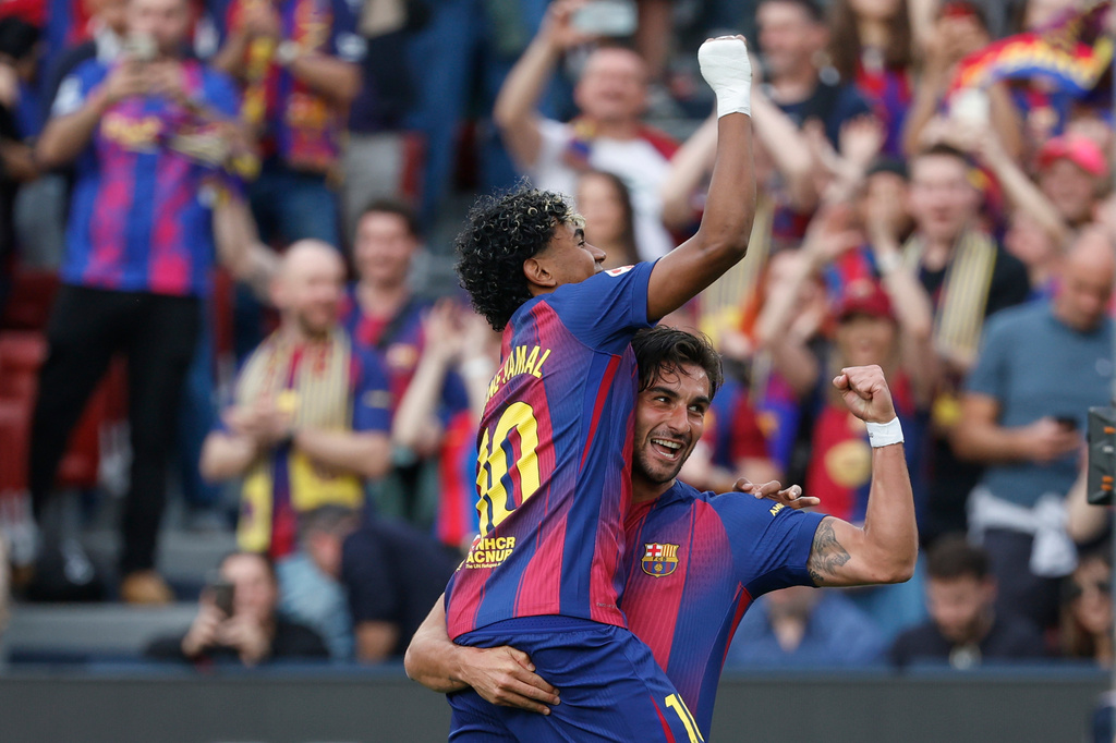 Barcelona's Ferran Torres, right, celebrates after scoring the opening goal with Barcelona's Lamine Yamal during the Spanish La Liga soccer match between Barcelona and Espanyol in Barcelona, Spain, Saturday, April 11, 2026. (AP Photo/Joan Monfort)