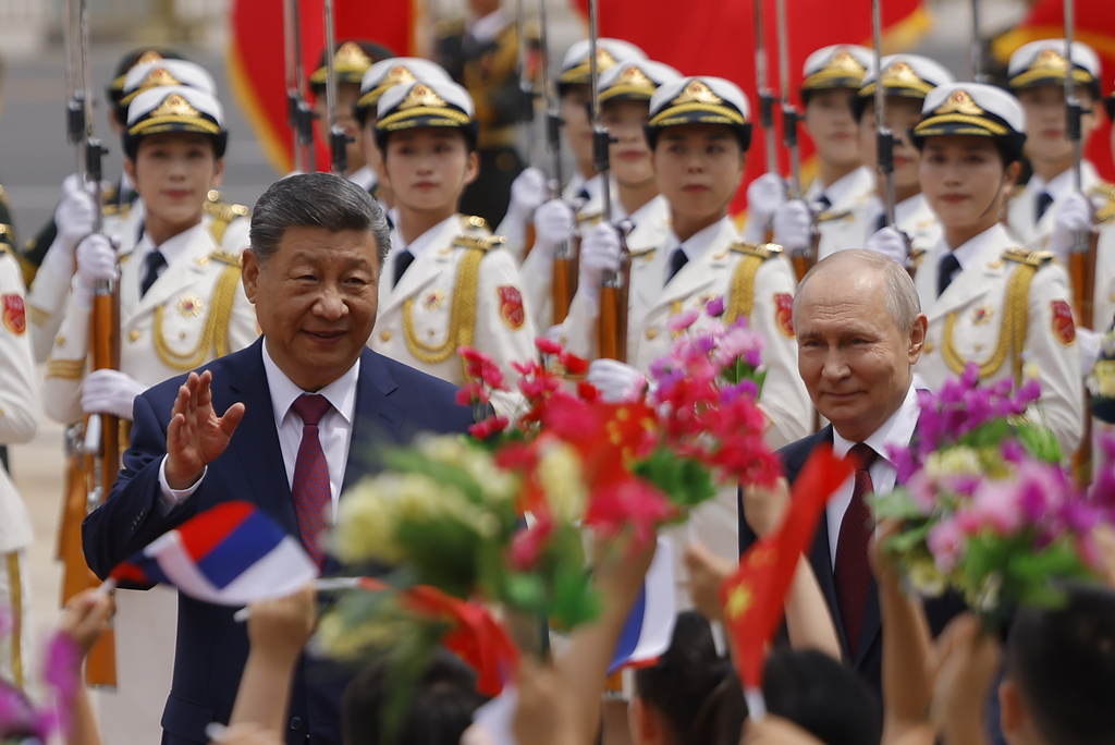 Russian President Vladimir Putin, right, and Chinese President Xi Jinping attend a welcoming ceremony at the Great Hall of the People in Beijing Wednesday, May 20, 2026. (Maxim Shemetov/Pool Photo via AP)