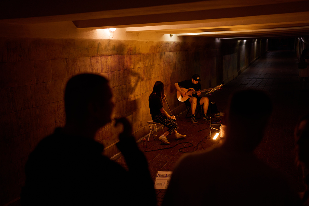 Musicians play in an under pass in central Kyiv, Sunday, Aug. 23, 2026. (AP Photo/Francisco Seco)