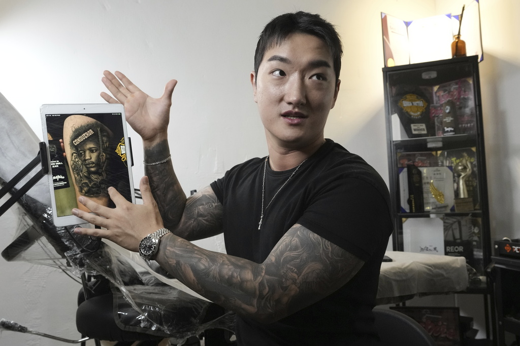 Tattoo artist Song Jaemin speaks during an interview with The Associated Press at his studio in Goyang, South Korea, Thursday, Sept. 18, 2025. (AP Photo/Ahn Young-joon)