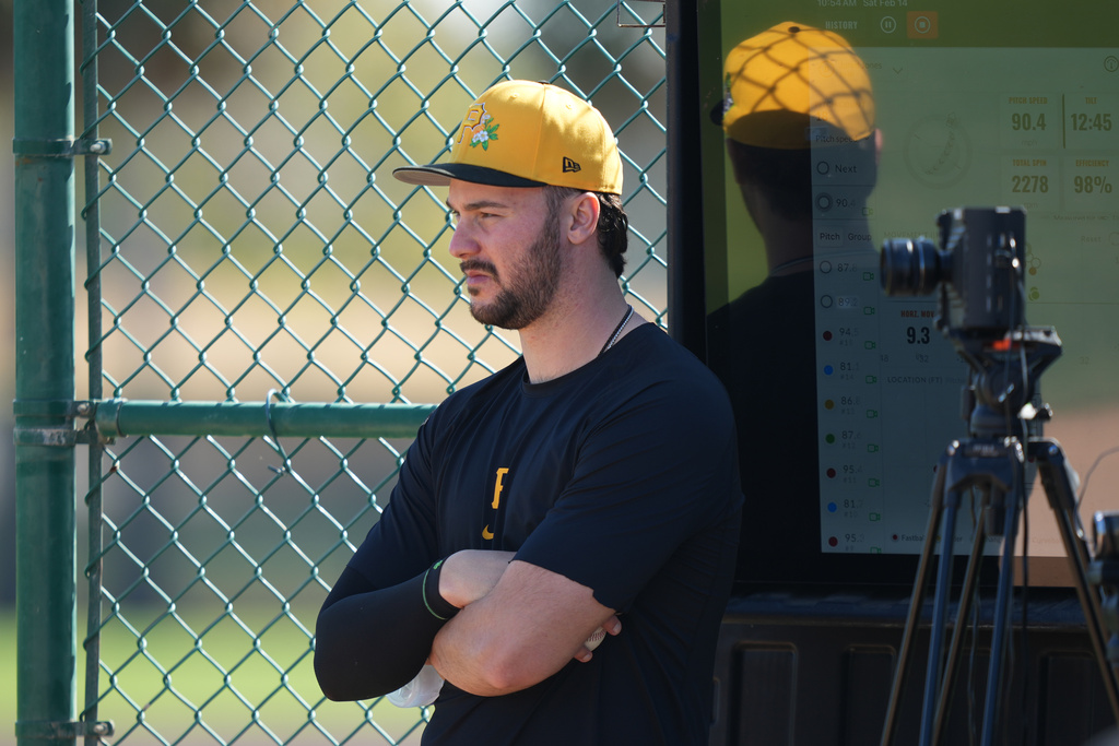 Pittsburgh Pirates' Paul Skenes watches workouts during spring training baseball Saturday, Feb. 14, 2026, in Bradenton, Fla. (AP Photo/Matt Slocum)