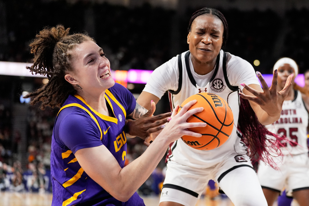 LSU forward Grace Knox vies for the ball with South Carolina forward Maryam Dauda during the first half of an NCAA college basketball game in the semifinals of the Southeastern Conference tournament, Saturday, March 7, 2026, in Greenville, S.C. (AP Photo/Chris Carlson)