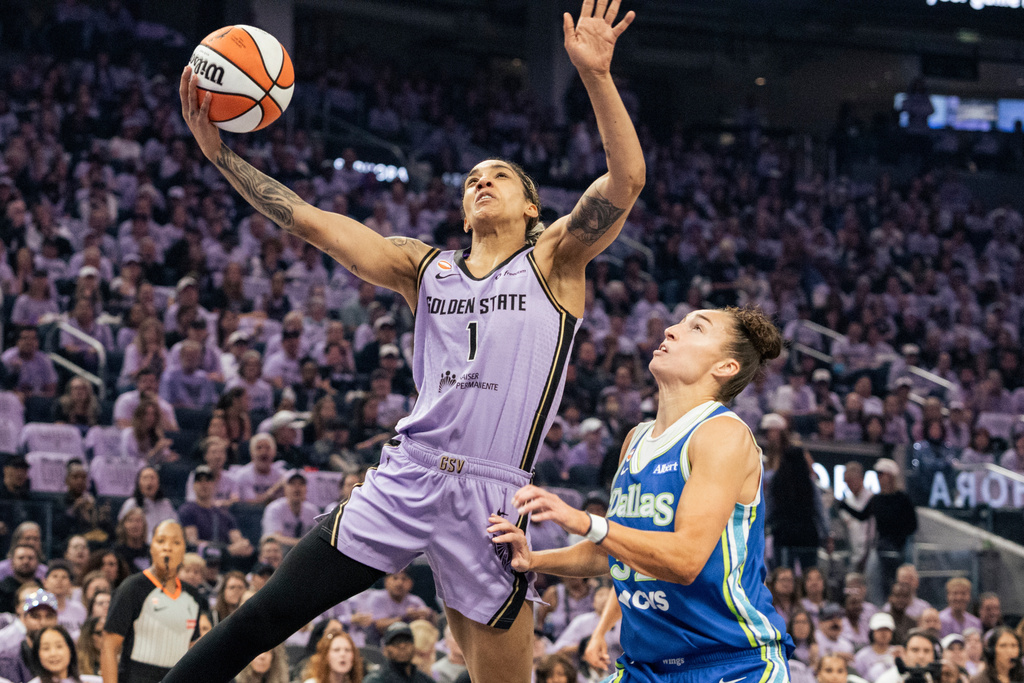 Golden State Valkyries forward Gabby Williams (1) drives for a layup against the Dallas Wings during the first quarter of Game 3 of a WNBA basketball first-round playoff series Friday, Oct. 2, 2026, in San Francisco. (Stephen Lam/San Francisco Chronicle via AP)