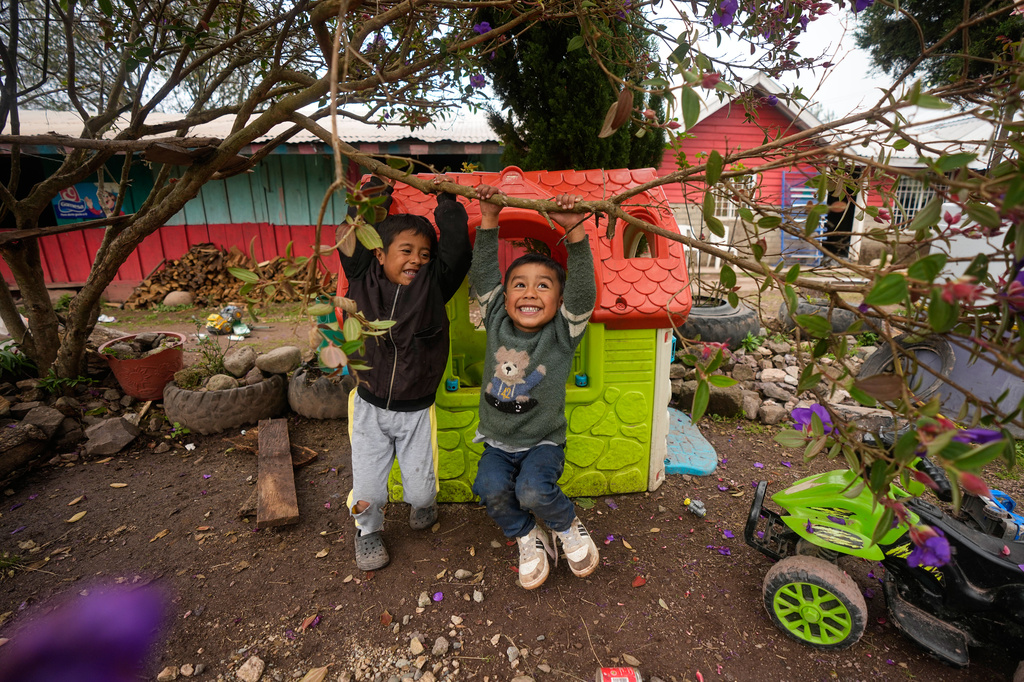 Children play in the main square in El Balcon, Mexico, Monday, Oct. 26, 2026. (AP Photo/Fernando Llano)