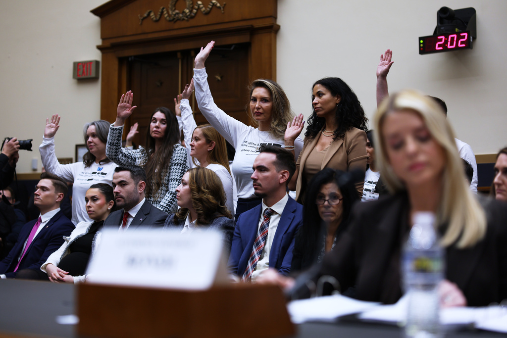 Attorney General Pam Bondi testifies before a House Judiciary Committee oversight hearing on Capitol Hill in Washington, Wednesday, Feb. 11, 2026, in Washington, as Jeffrey Epstein survivors, stand left. (AP Photo/Tom Brenner)