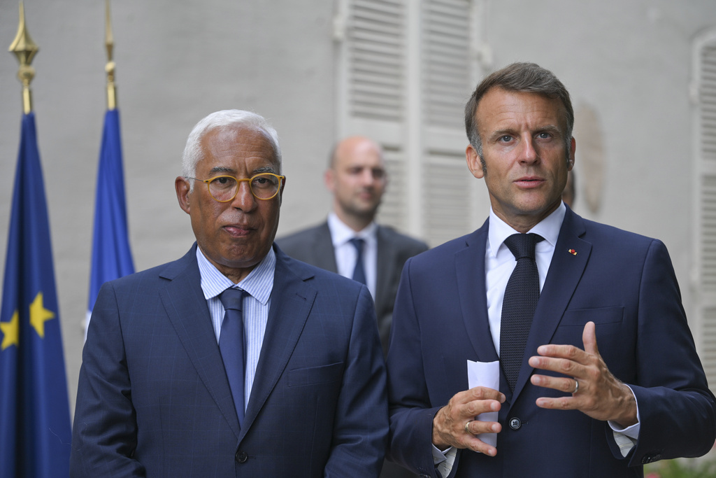 French President Emmanuel Macron, right, and Antonio Costa, President of the European Council, attend a statement following a video conference on Ukraine at the Fort de Bregancon in Bormes-les-Mimosas, southern France, Wednesday Aug.13, 2025. (Philippe Magoni, Pool via AP)