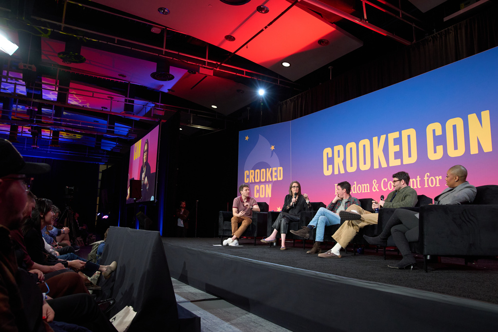 Panelists, from left, Jon Lovett, of "Pod Save America," Jessica Tarlov, co-host of Fox News' "The Five," Tim Miller, of "The Bulwark Podcast," Hasan Piker, streamer and political commentator, and Symone Sanders Townsend, co-host of MSNBC's "The Weeknight," speak during Crooked Con , Friday, Nov. 7, 2025, in Washington. (AP Photo/Jacquelyn Martin)