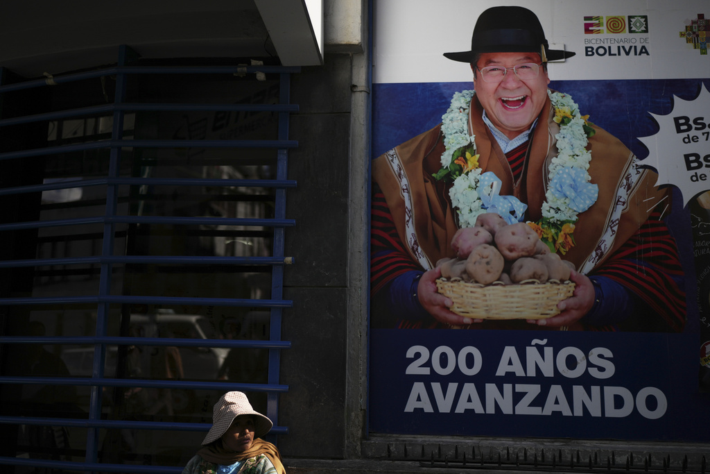 A poster of Bolivian President Luis Arce reads in Spanish, "200 years going forward," ahead of Sunday's presidential and legislative elections in La Paz, Bolivia, Thursday, Aug. 14, 2025. (AP Photo/Natacha Pisarenko)