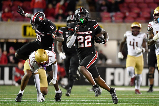 Louisville running back Keyjuan Brown (22) breaks for the end zone ahead of the Boston College defense during the second half of an NCAA college football game in Louisville, Ky., Saturday, Oct. 25, 2025. Louisville won 38-24. (AP Photo/Timothy D. Easley) Louisville running back Keyjuan Brown (22) breaks for the end zone ahead of the Boston College defense during the second half of an NCAA college football game in Louisville, Ky., Saturday, Oct. 25, 2025. Louisville won 38-24. (AP Photo/Timothy D. Easley)