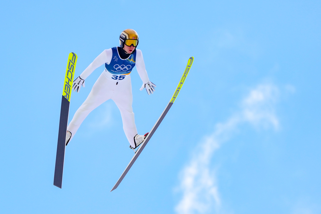 Jens Luraas Oftebro, of Norway, soars through the air during his competition round jump of the nordic combined individual Gundersen large hill/10km at the 2026 Winter Olympics, in Predazzo, Italy, Tuesday, Feb. 17, 2026. (AP Photo/Kirsty Wigglesworth)